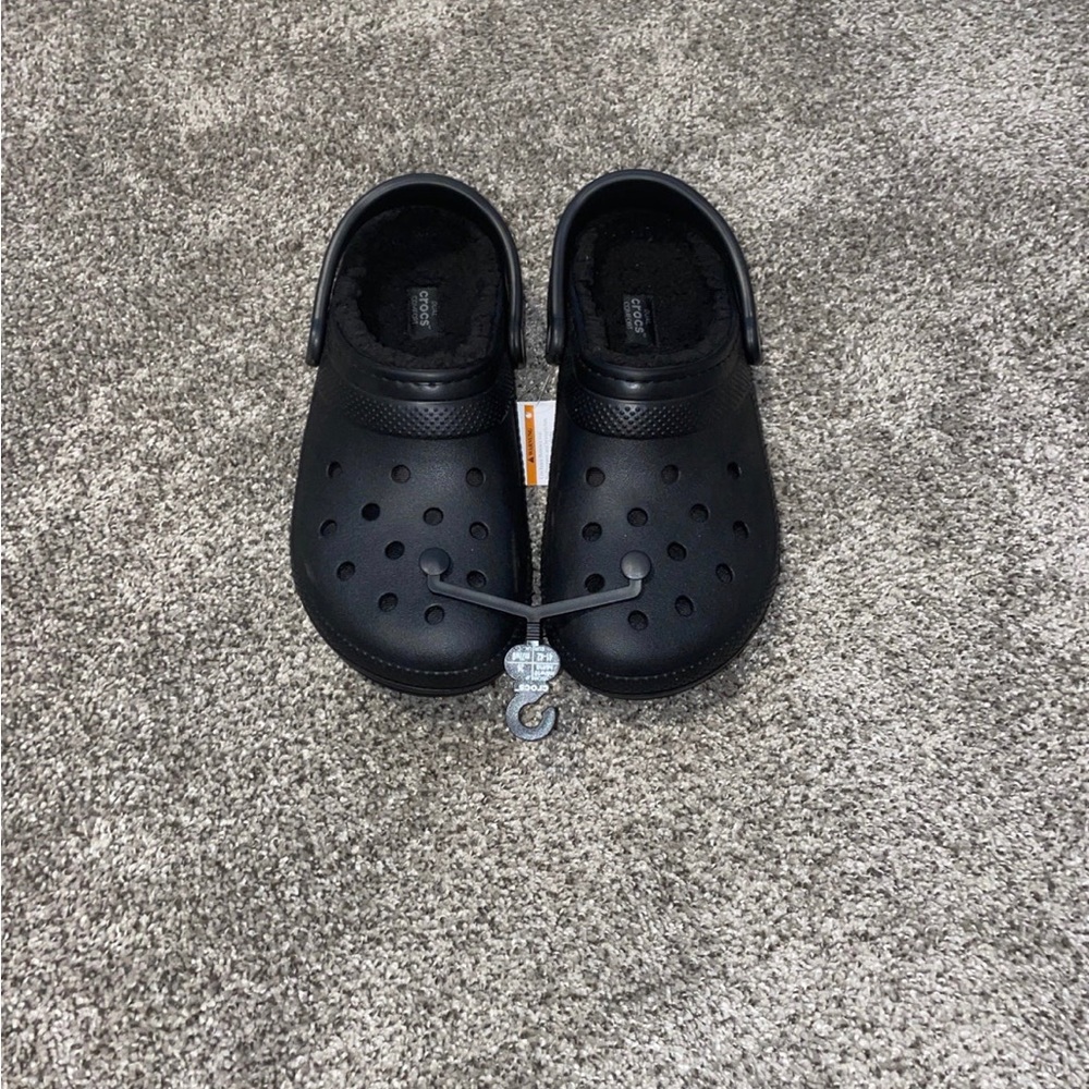 Black fluffy Crocs. Men’s 8 women’s 10.